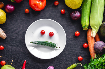 Flat lay, vegetables on a wooden background and an plate with paper.