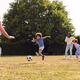 Multi-Generation Family At Home In Garden Playing Football Or Soccer Together - PhotoDune Item for Sale