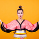 Beautiful young woman wearing japanese costume over yellow background - PhotoDune Item for Sale