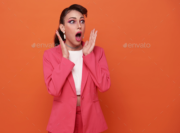 Young emotional surprised beautiful woman standing with open mouth Wow.