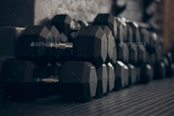 Work hard and lift heavy. Closeup shot of dumbbells in a gym.