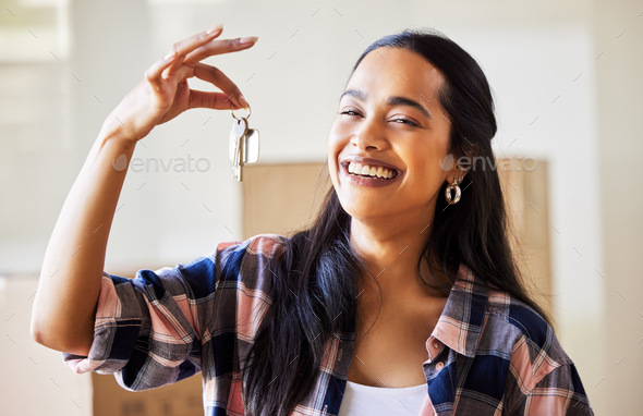 This is a chance to create new memories. Shot of a young woman showing the keys to her new home.