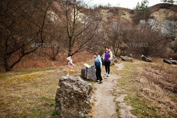 Family at Turold science trail, Mikulov, Czech Republic learn types of rock breeds.