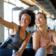 Happy fit women, friends smiling, talking and taking photos after work out in gym. Social media. - PhotoDune Item for Sale