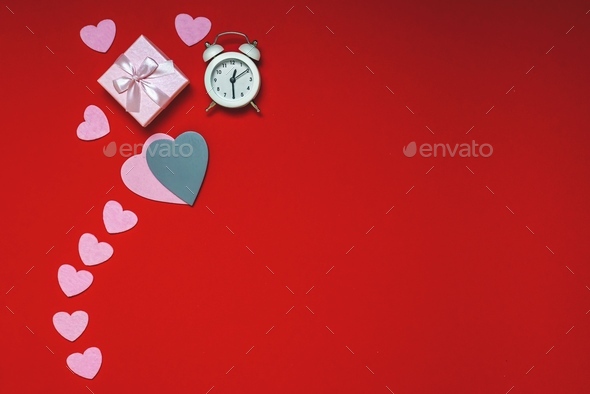 Top view of workspace time for valentines day flat lay on red background, heart gifts , copy space