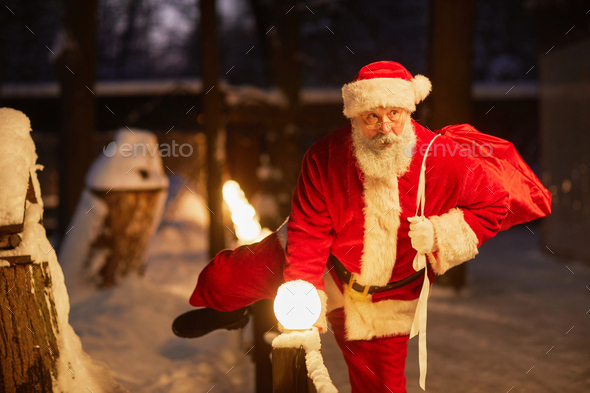 Santa Delivering Presents At Night