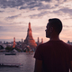 Rear view of tourist against Bangkok skyline at sunset - PhotoDune Item for Sale