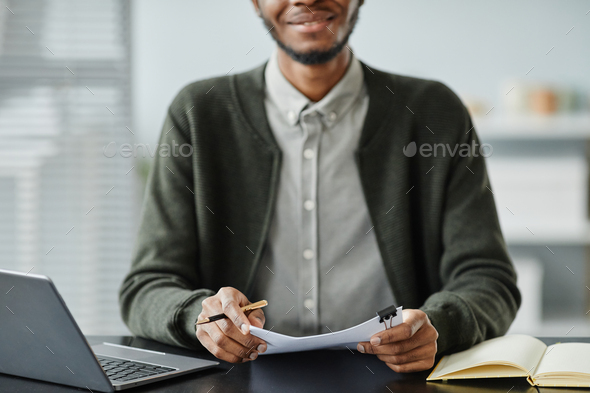 Young Black Man Holding Cv in Job interview