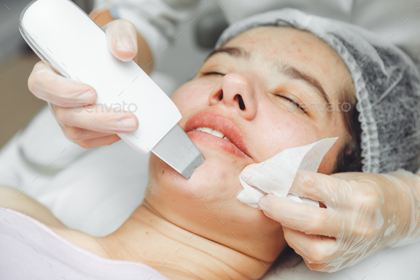 Ultrasonic cosmetic scrubber. Facial cavitation procedure.  - Stock Photo - Images
