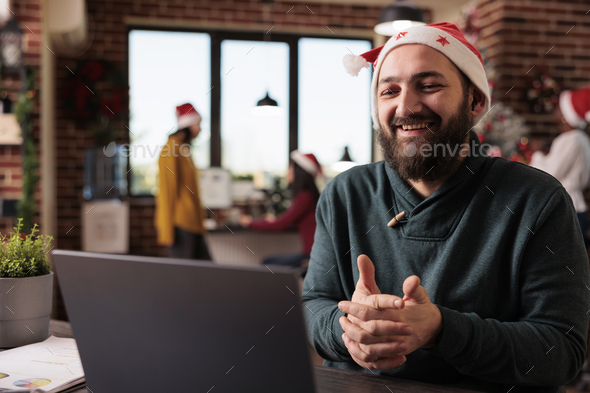 Startup employee using online videocall meeting at job