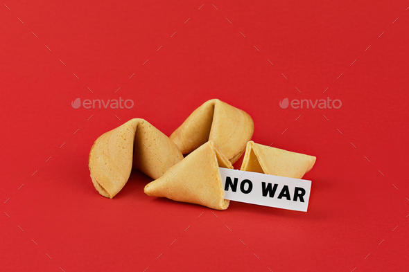 Chinese fortune cookies on red background with inscription NO WAR. Call for peace and an end to war.
