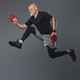 Jumping elderly man holding fitness disks against grey background - PhotoDune Item for Sale