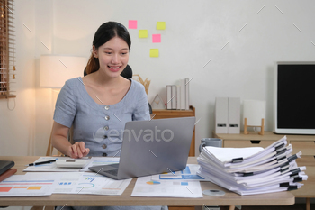 Portrait of Young woman using laptop computer at the office, Student girl working at home. Work or