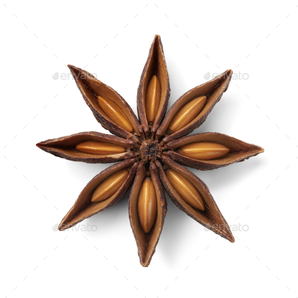Single star anise and seed seen from above on white background