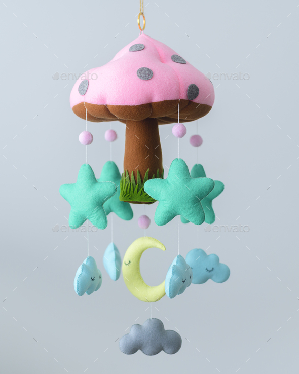 Beautiful Baby Cot mobile, Plushie mushroom with stars, clouds, and the moon hanging from strings.