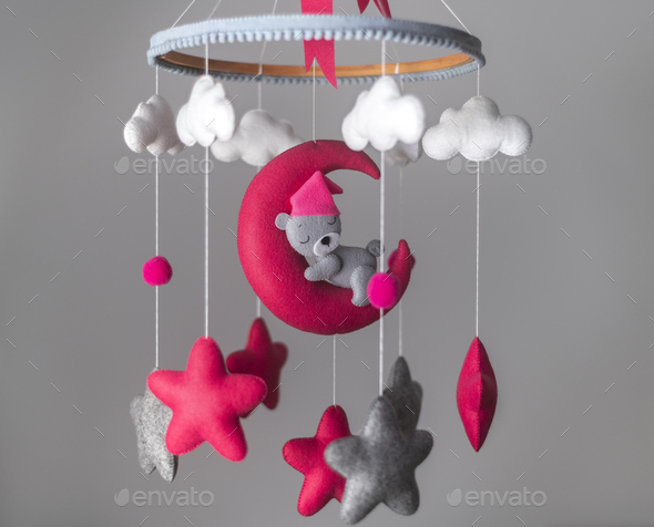 Baby cot mobile, musical toy hang over the crib. Dreamy bear in the moon,