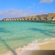 Waves crashing on a beach with picturesque overwater bungalows in the Maldives - VideoHive Item for Sale