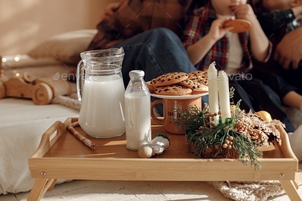 Chocolate chip cookies with milk in bottles on wooden tray - Stock Photo - Images
