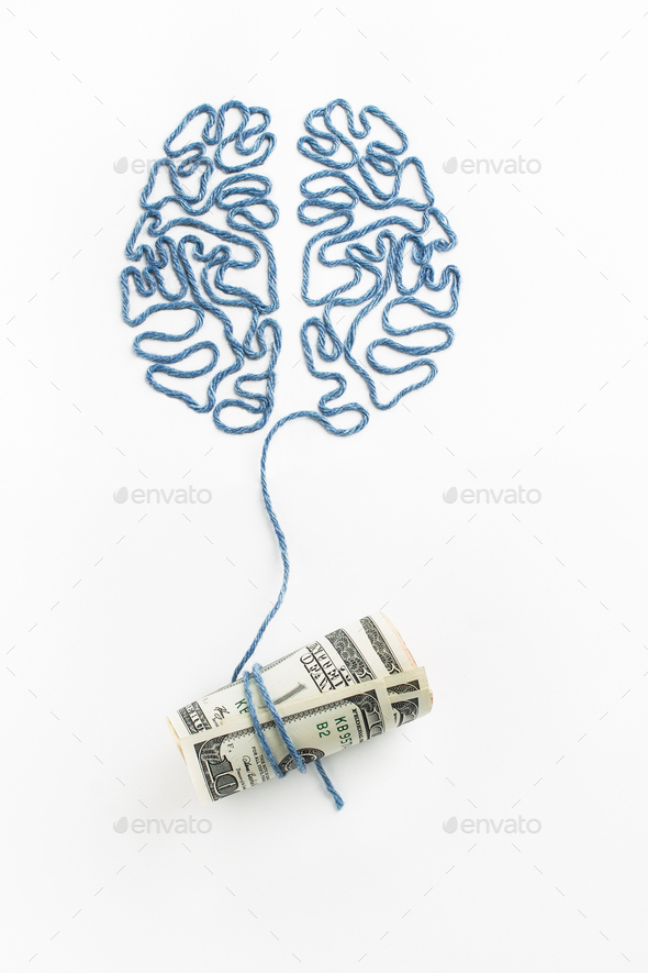 Brain and money connected by a thread on a white background