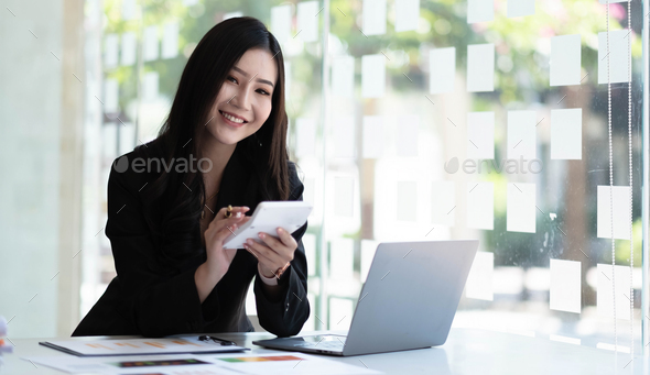 Businesswoman hands hold calculator with financial statistic stock photo,discussion and report
