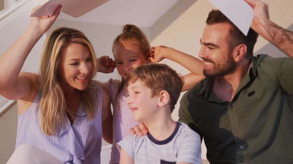 Portrait of Caucasian family spending time at home together alt