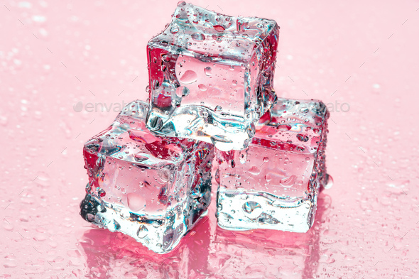 Square melting ice cubes on wet table Stock Photo by FabrikaPhoto