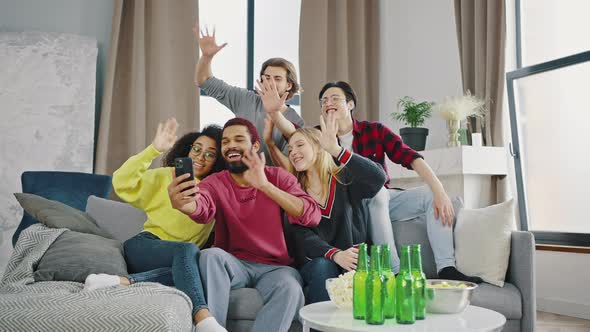 Group of Friends Has a Video Call on a Smartphone alt