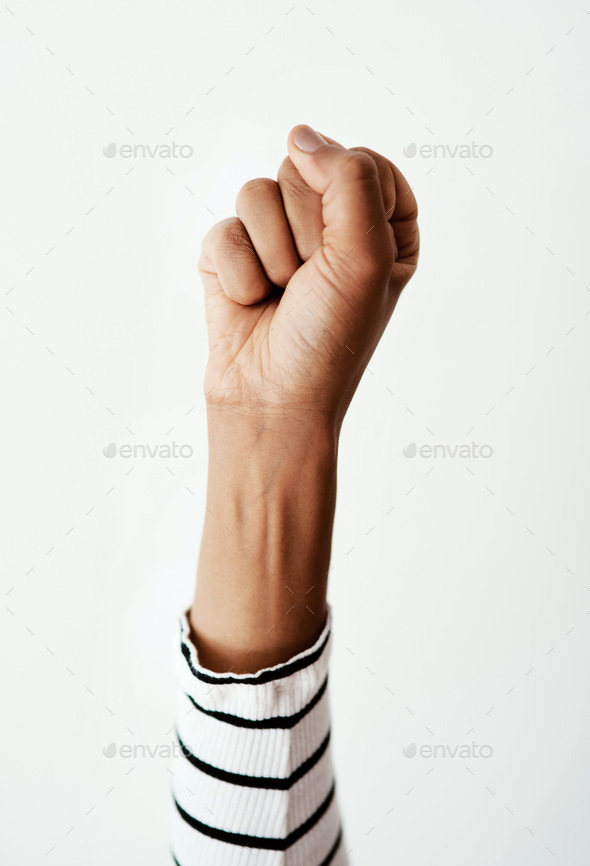 Power to the people. Cropped studio shot of a woman raising her fist against a white background.