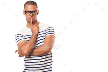 Man fashion model posing against a studio background