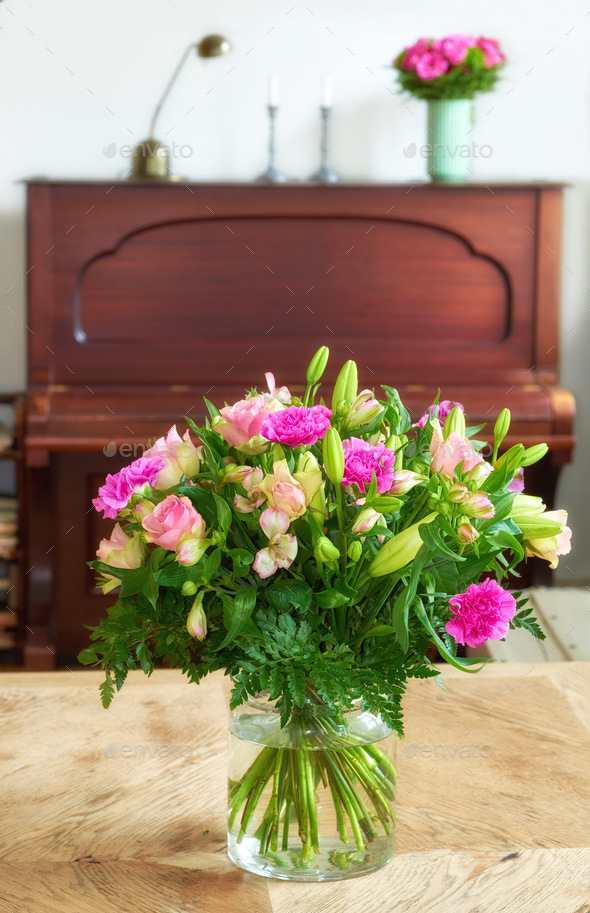 Bouquet indoor. Bouquet in font of piano. - Stock Photo - Images