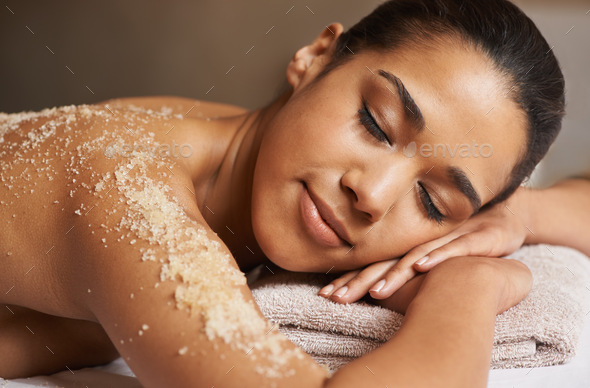 Total body exfoliation. Closeup shot of a young woman relaxing during a spa treatment.