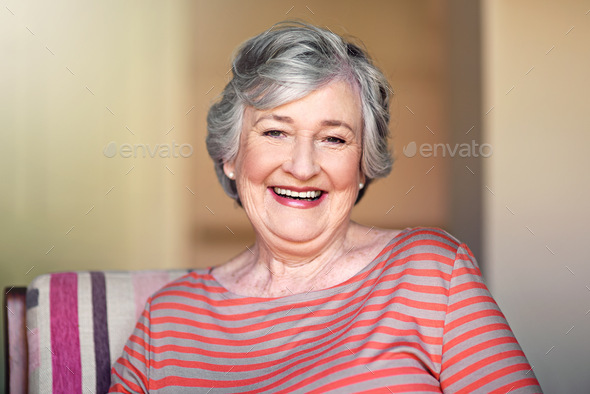 Facing each day with a positive attitude. Shot of a senior woman relaxing at home.