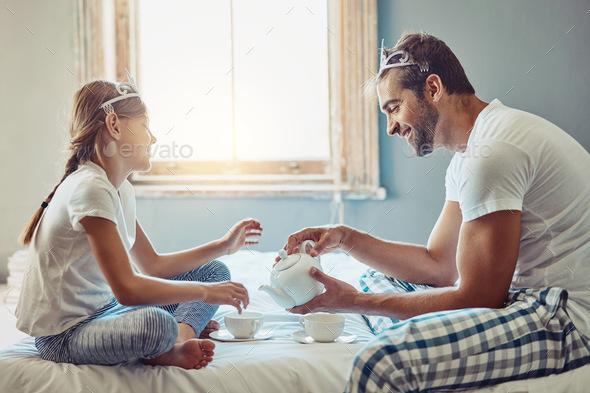 Nothing beats daddy-daughter playtime. Shot of a father and daughter having a tea party at home.