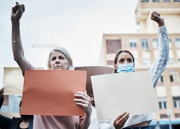 Fight for your future. Shot of a mature woman protesting the covid vaccine.