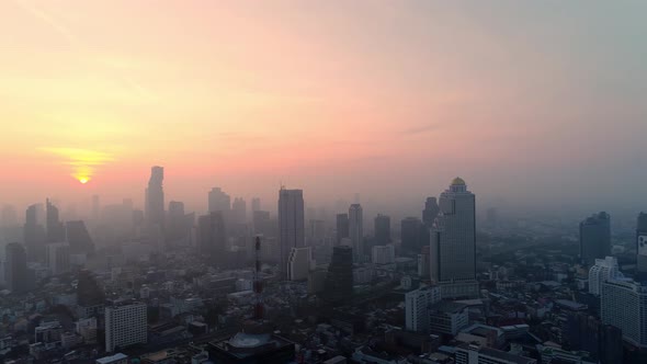 4k Aerial city view of Bangkok dowtnown, Flying over Bangkok, Thailand. alt