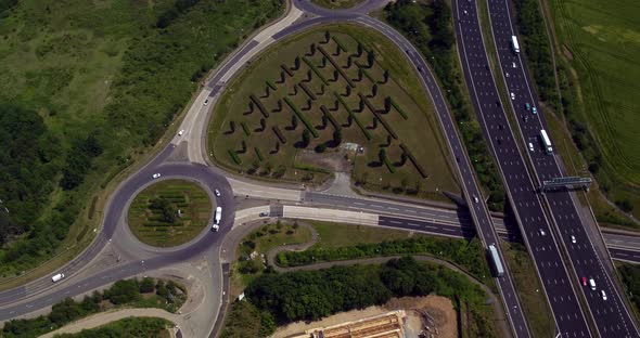 Aerial view of the A2 / M2 Ebbsfleet junction located in Kent, UK. Top down drone shot of the juncti alt