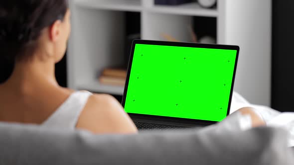Woman with Green Screen Computer