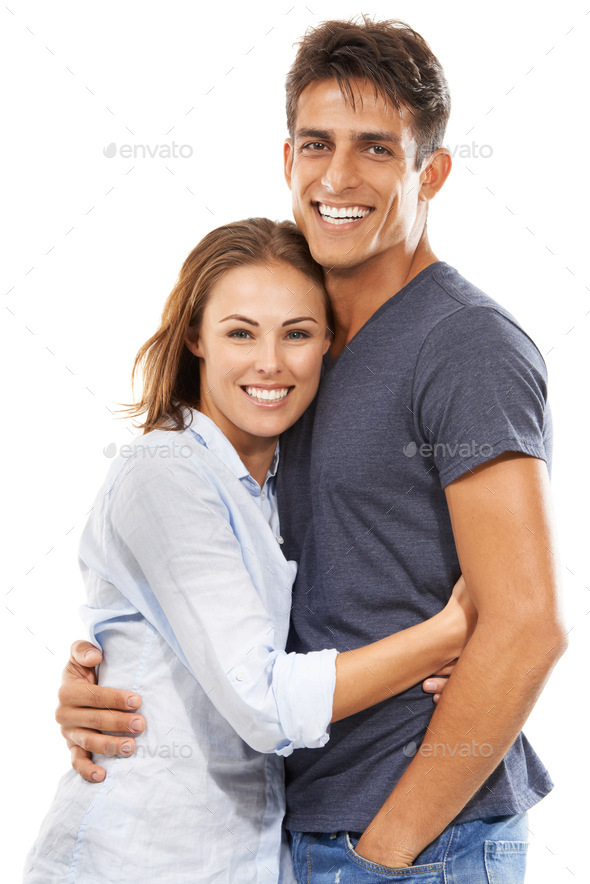 Our love will last an eternity. A happy young couple embracing happily against a white background.