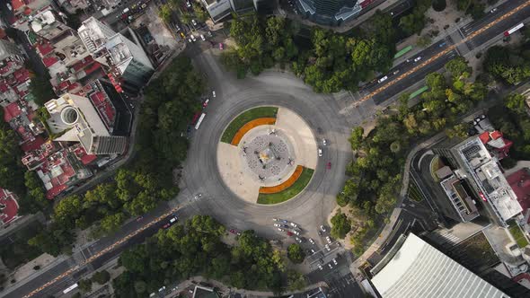 Roundabout Angel of independence on aerial footage in CDMX. Reforma Avenue with cempasuchil on cenit alt
