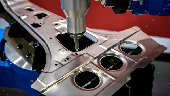 Industrial robotic welders weld the car body. Automobile production