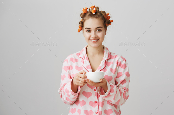 Nothing can be better than coffee in morning. Portrait of attractive friendly woman at home wearing