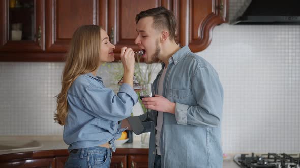 Charming Loving Woman Feeding Man with Sweet Delicious Pie alt