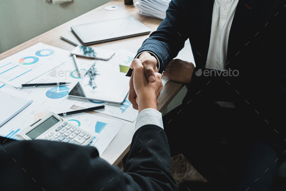 Businessman handshake for teamwork of business merger and acquisition,successful negotiate, two - Stock Photo - Images