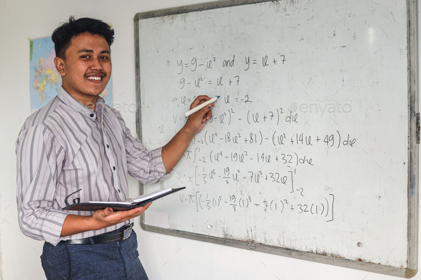 Smiling teacher teaching mathematics Stock Photo by Queenmoonlite ...