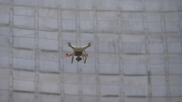 Drone Flies Against a Concrete Wall