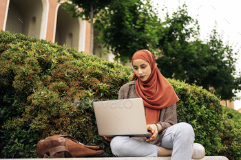 Young Muslim Woman Using Computer