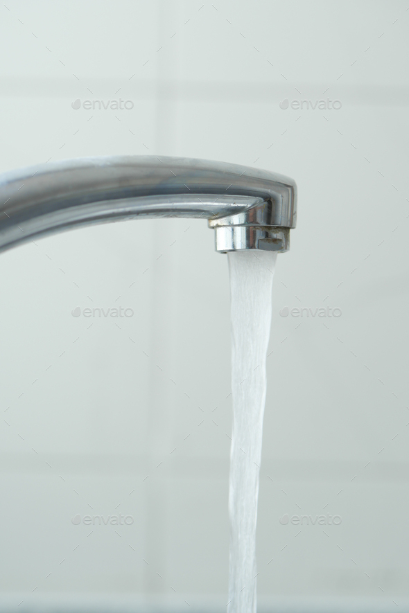 water pouring from a faucet tap slow motion Stock Photo by towfiqu98