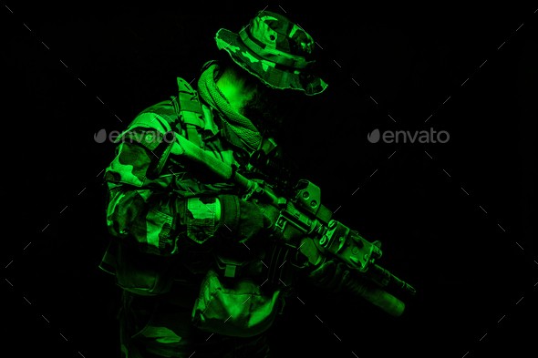 Commando soldier in battle ammunition, armed rifle - Stock Photo - Images
