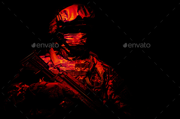 Special forces soldier in the red light - Stock Photo - Images