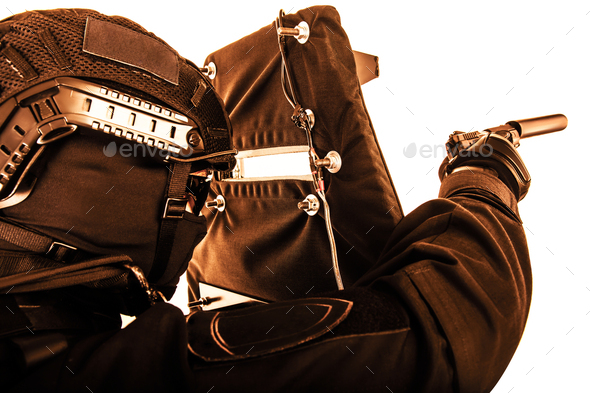 Armed SWAT fighter hiding behind ballistic shield - Stock Photo - Images